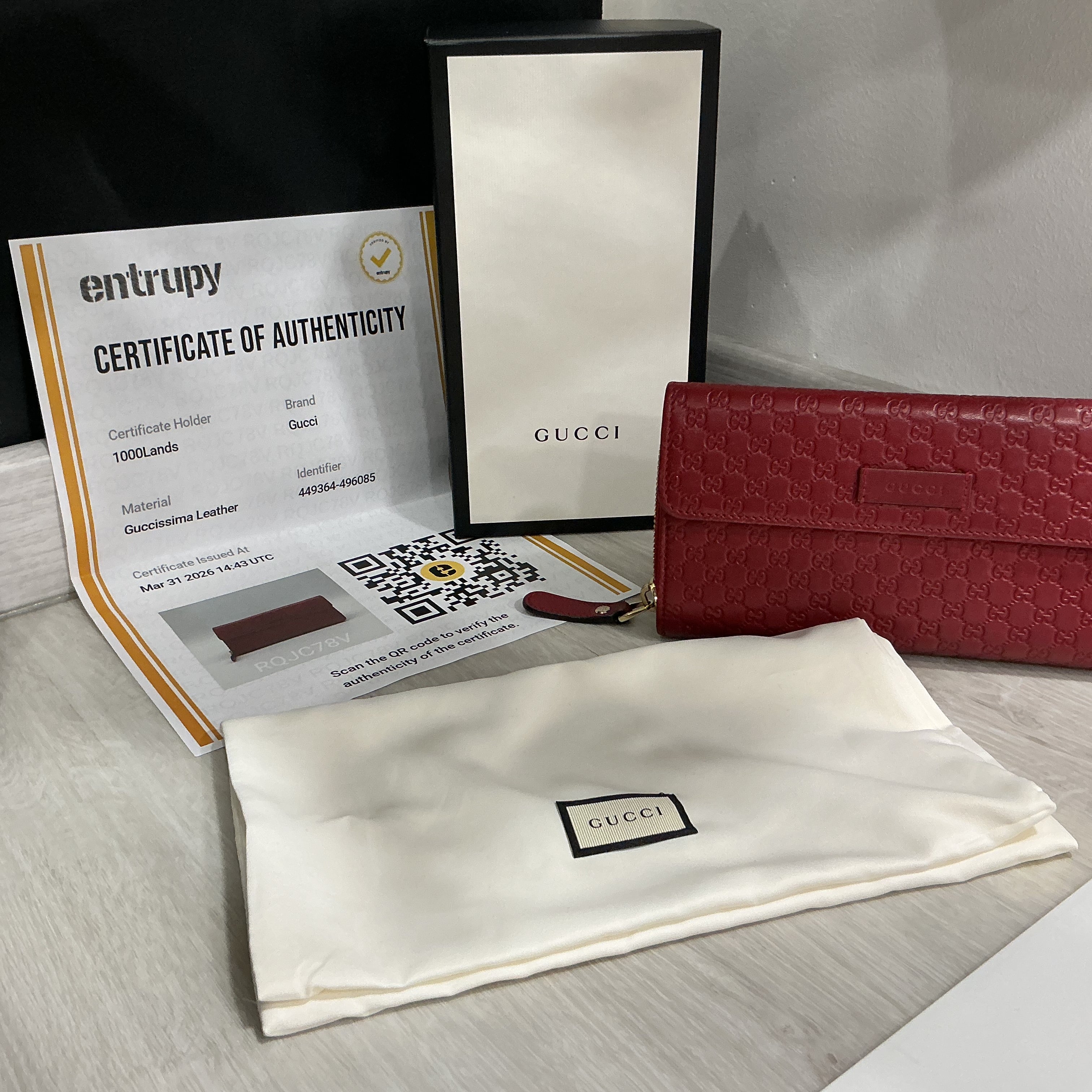 Portafoglio Gucci in pelle Guccissima bordeaux [Preloved]