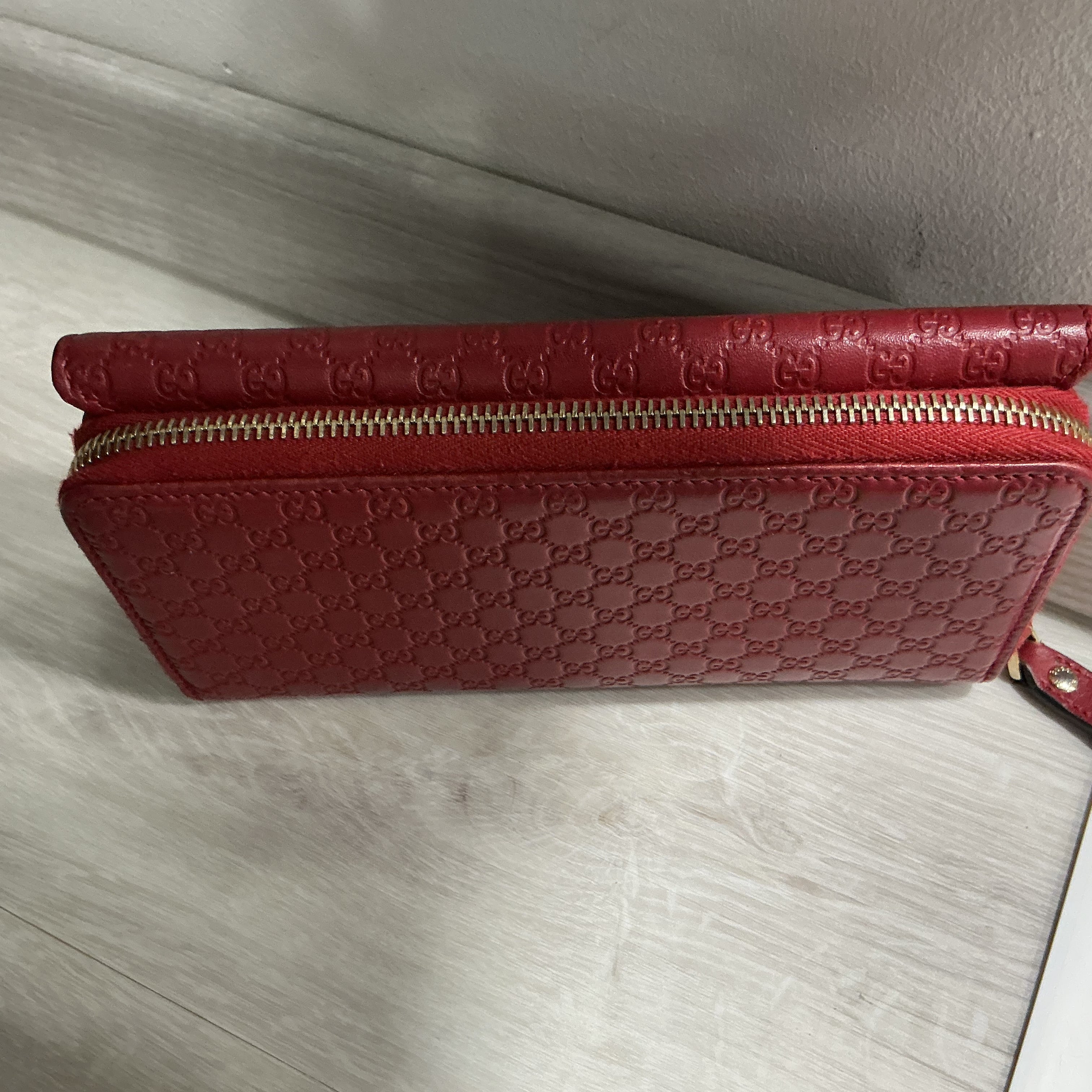 Portafoglio Gucci in pelle Guccissima bordeaux [Preloved]