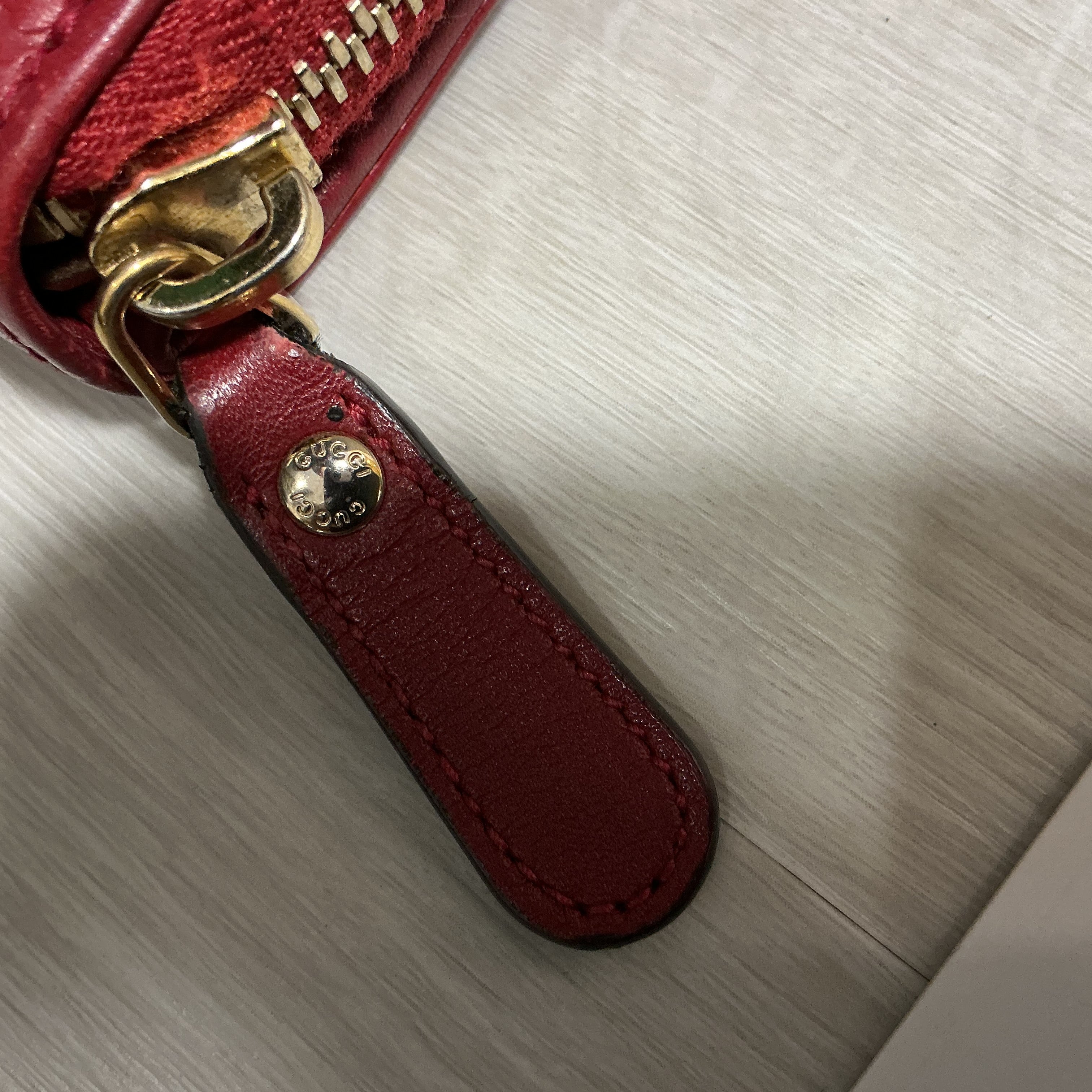 Portafoglio Gucci in pelle Guccissima bordeaux [Preloved]