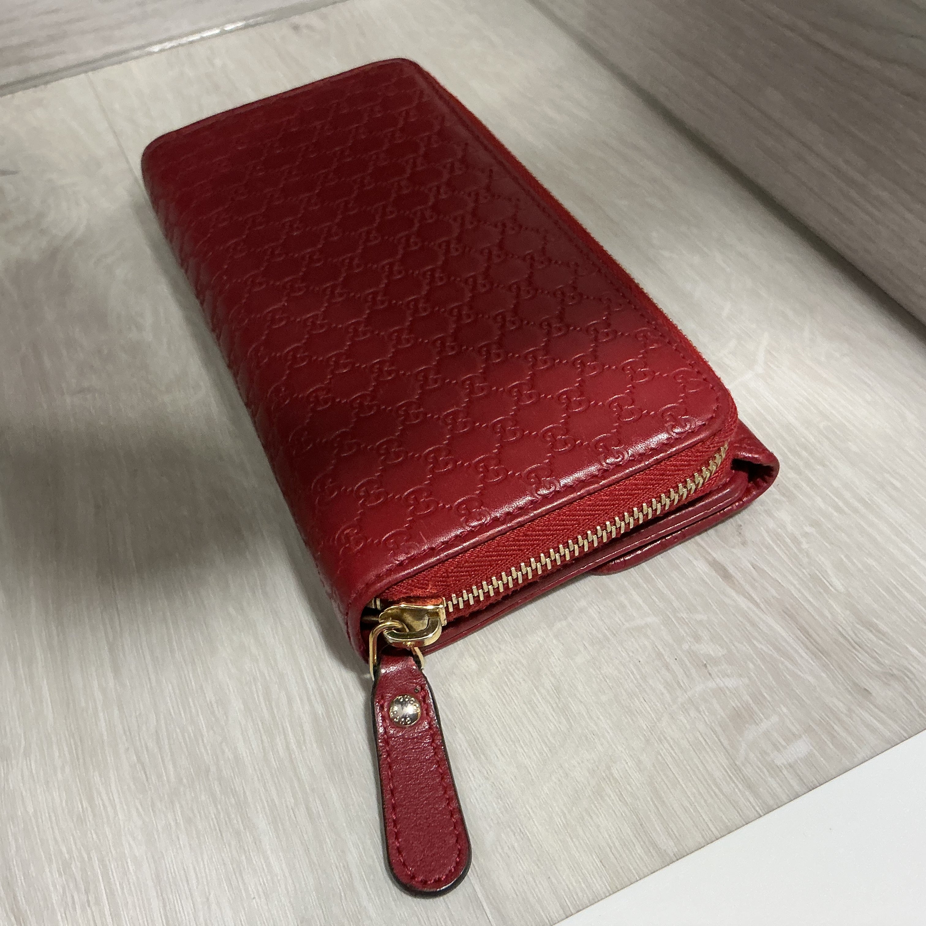 Portafoglio Gucci in pelle Guccissima bordeaux [Preloved]