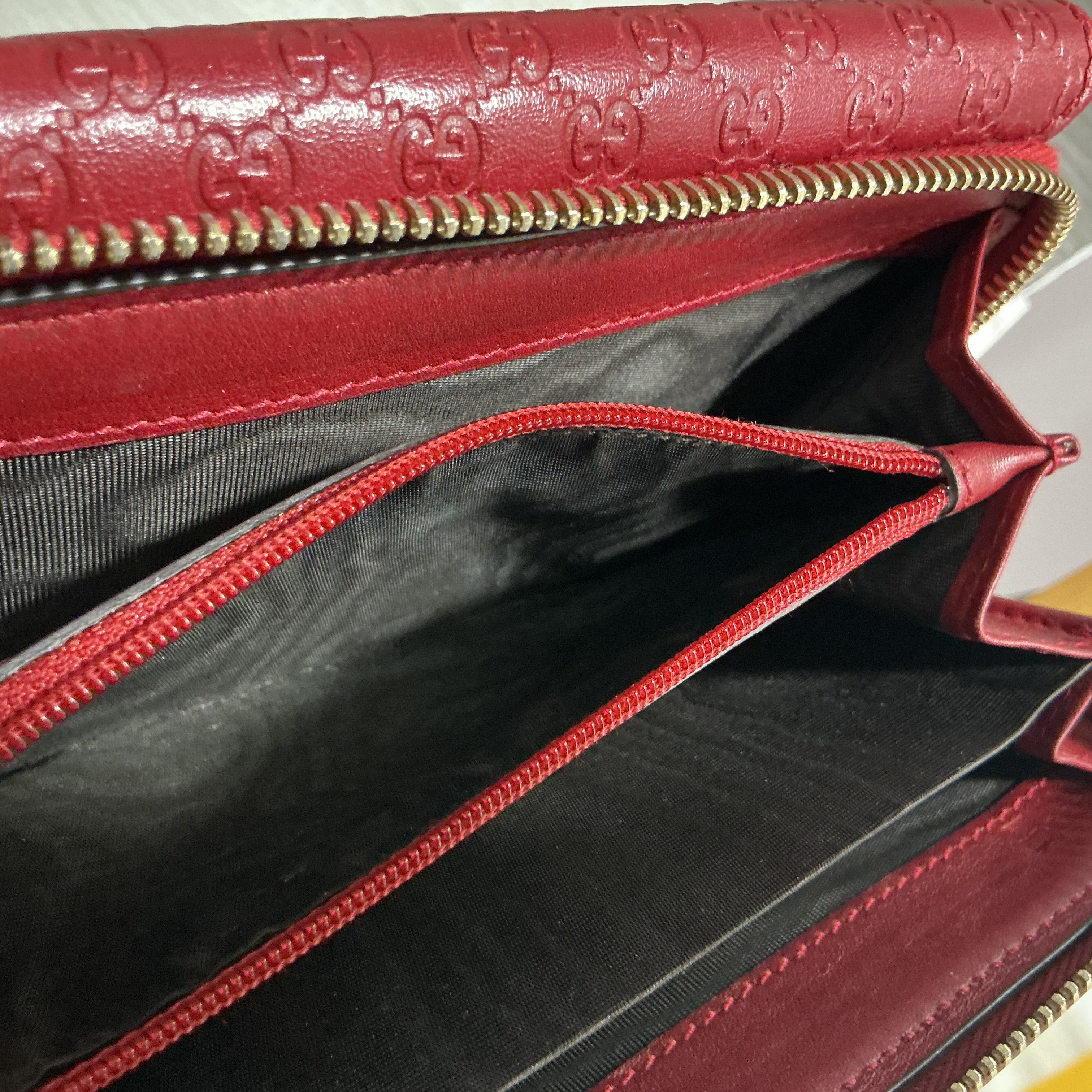 Portafoglio Gucci in pelle Guccissima bordeaux [Preloved]